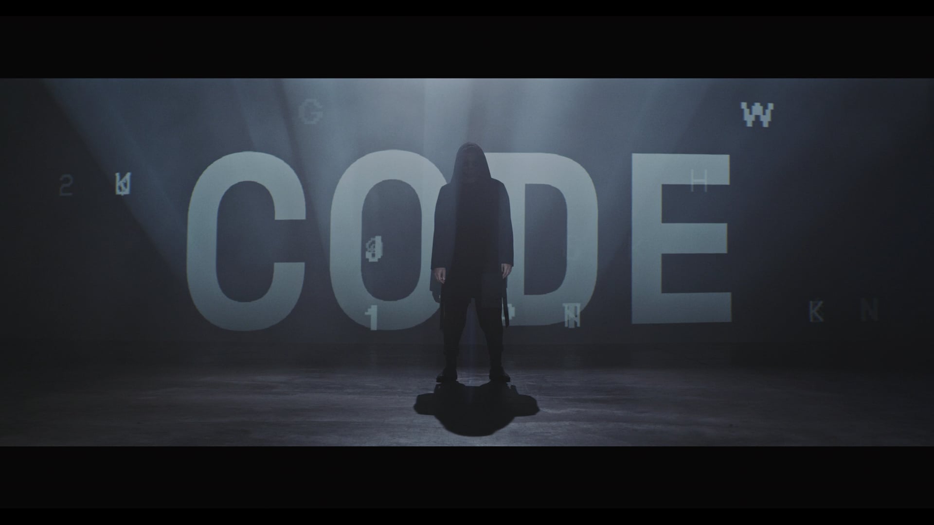 man_wearing_hoodie_standing_on_dark_stage_with_words_flashing_over_him_by_MXR_Productions_Artgrid-HD_H264-HD